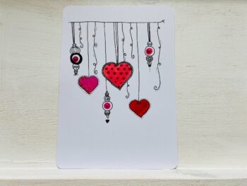 Postkarte Herzen hängend